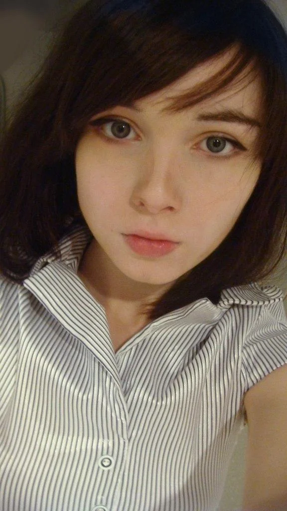 Katya Lischina selfie in pinstriped shirt
