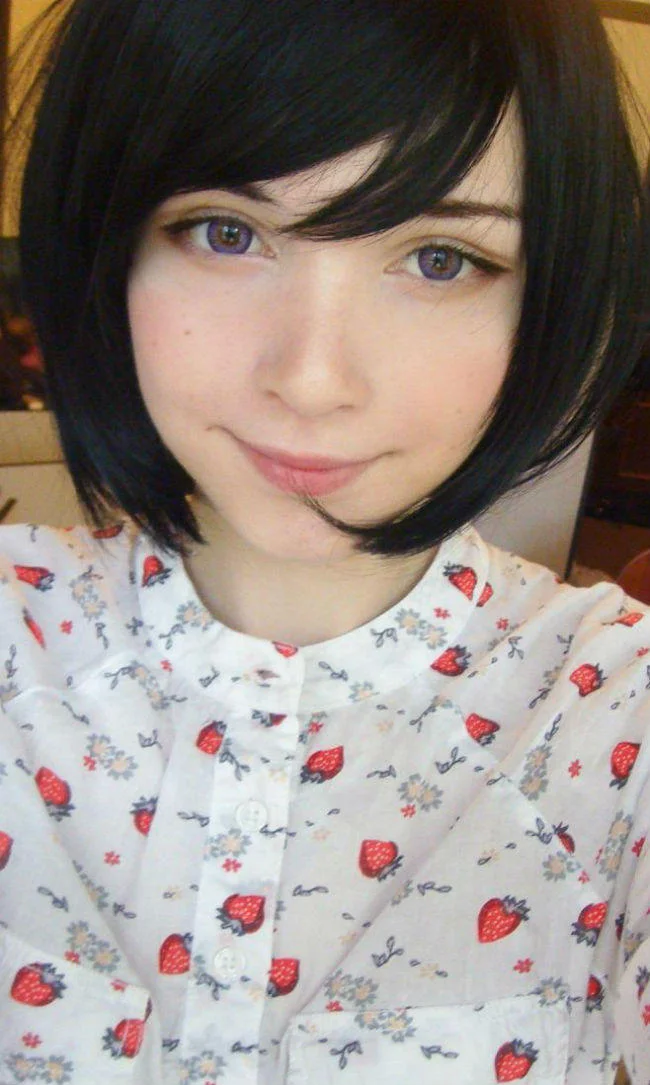 Katya Lischina selfie with black bob and strawberry-print blouse