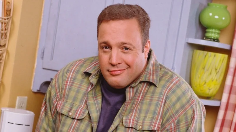 Kevin James Smirking — Professional Getty Images stock photograph of Kevin James in checkered plaid shirt with characteristic confident smirk expression.