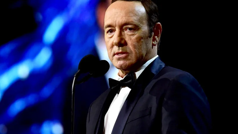 Kevin Spacey Sexual Assault Allegations — Kevin Spacey in a tuxedo speaking at a microphone on stage