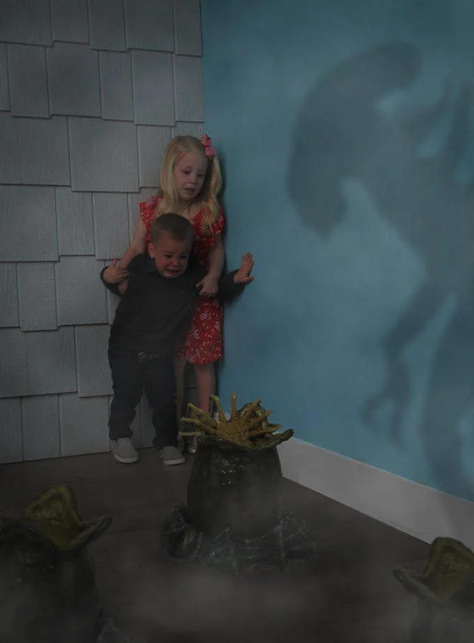 Kids Scared of Rabbit — Edited photo of the scared kids facing a xenomorph egg and facehuggers, with an alien shadow on the wall.