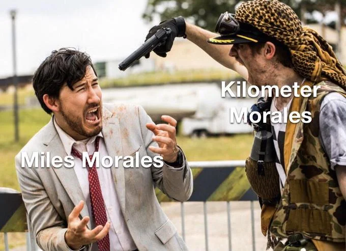 Kilometers Morales — Markiplier being held at gunpoint meme labeled Miles Morales and Kilometer Morales.