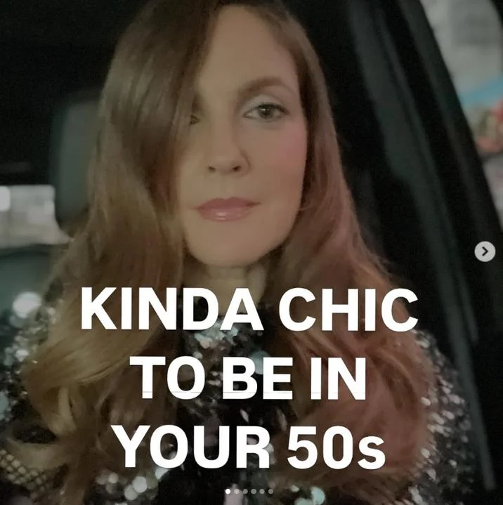 Kinda Chic Trend — Woman taking a selfie in a car with the text 'KINDA CHIC TO BE IN YOUR 50s' overlaid.