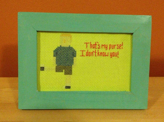 King of the Hill — Framed cross-stitch of Peggy Hill with quote That's my purse I don't know you