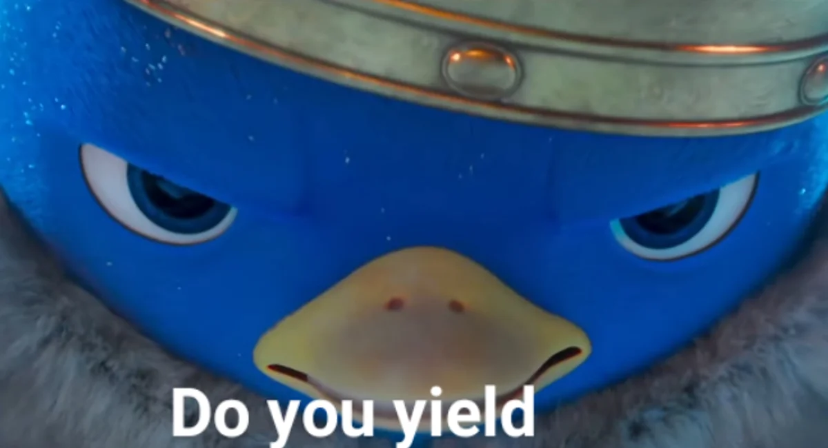 King Penguin's "Do You Yield?" — Close-up of the blue King Penguin wearing a crown with angry eyes and the text 'Do you yield' overlaid.