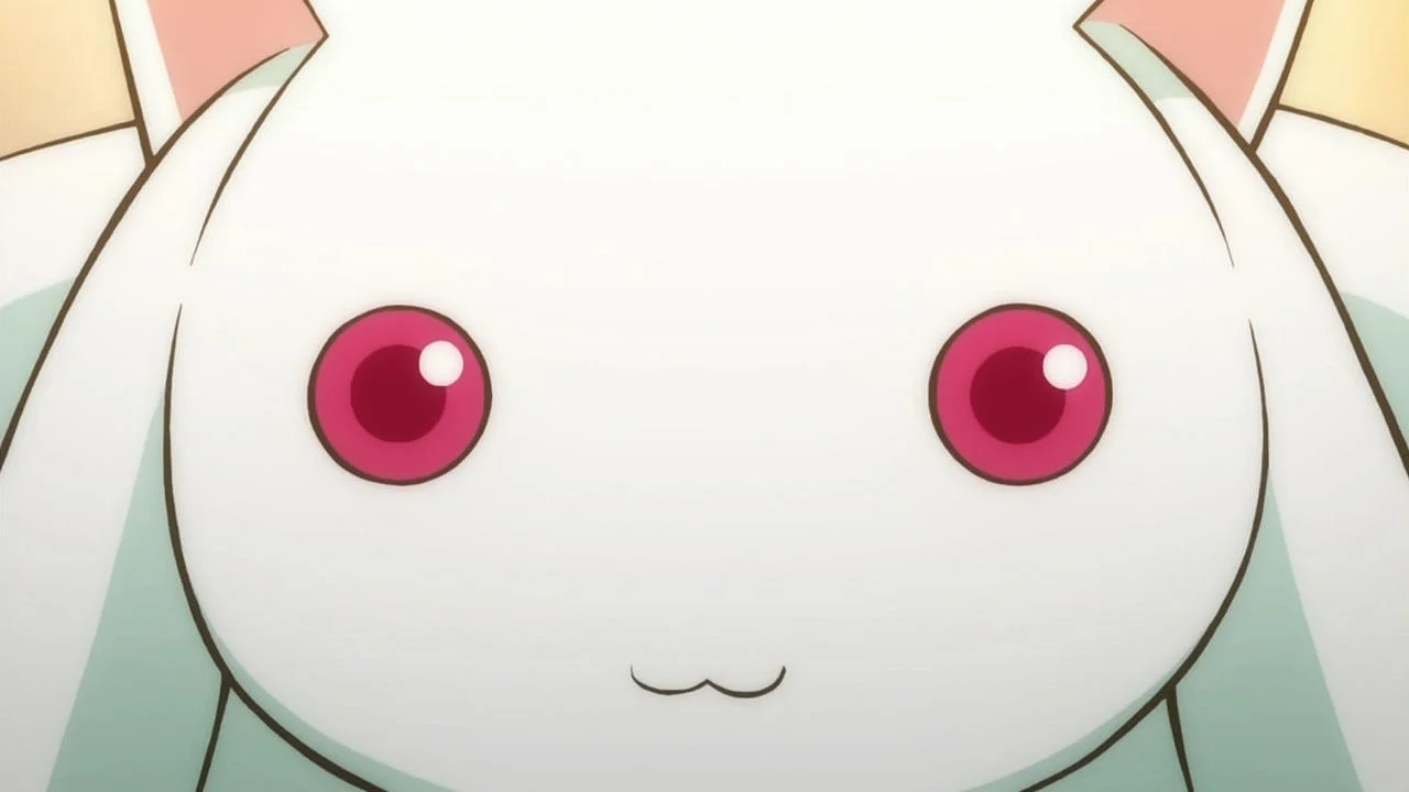 Close-up of Kyubey's white cat-like face with pink eyes from Madoka Magica anime.