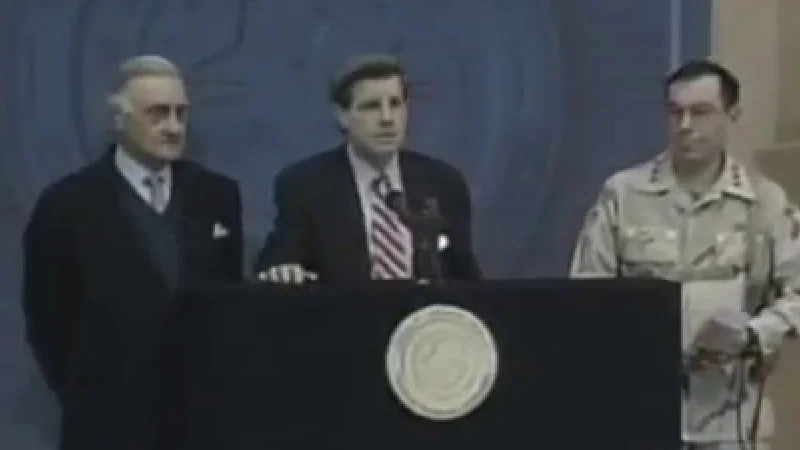 Ladies and Gentlemen, We Got Him — Three men standing at a podium during a 2003 press conference announcing the capture of Saddam Hussein