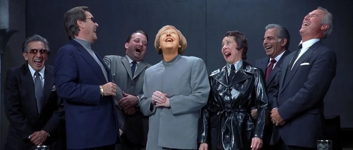 Laughing Theresa May — Photoshop of Theresa May's laughing face into a group laughing scene from a film