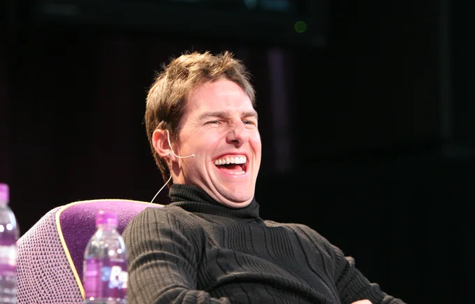 Pure laughing Tom Cruise meme template featuring the actor's distinctive maniacal expression with prominent wide grin in clean format.