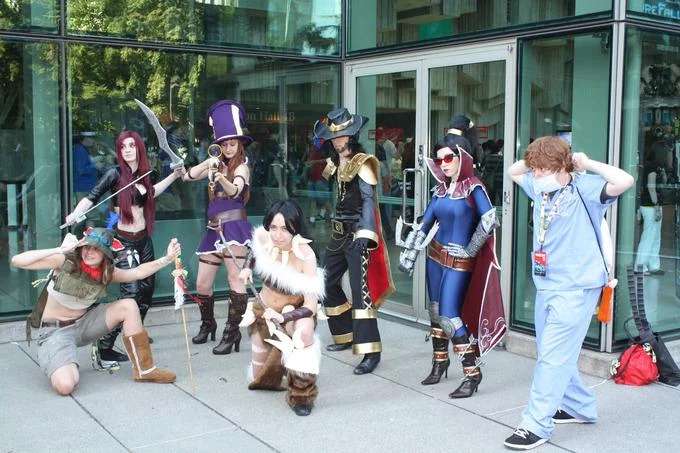 League of Legends cosplayers posing at a convention