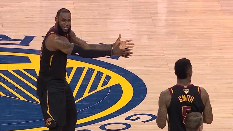 LeBron James's NBA Finals Reaction — LeBron James gestures with arms outstretched at JR Smith on the court