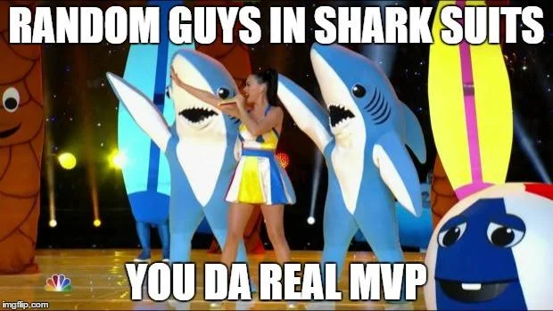 Person in shark costume in water - possible Left Shark fan content
