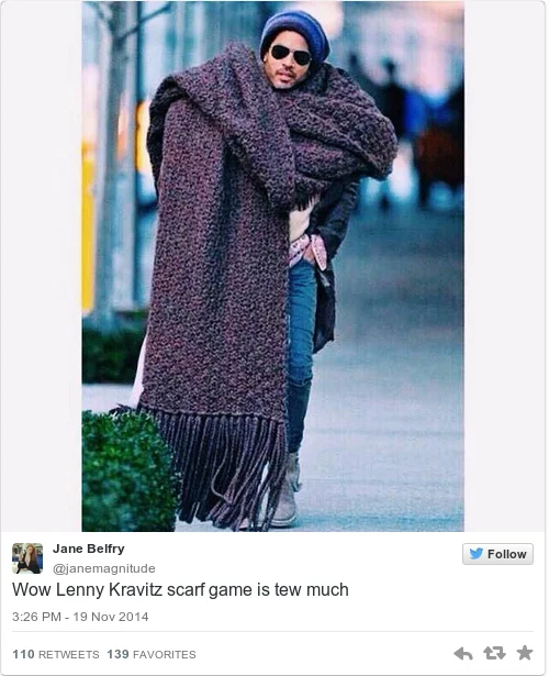 Lenny Kravitz's Giant Scarf — Lenny Kravitz walking down the street in a purple beanie and giant brown fringed knit scarf
