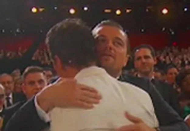 Leonardo DiCaprio's Oscar — Leonardo DiCaprio hugging a man at an awards ceremony