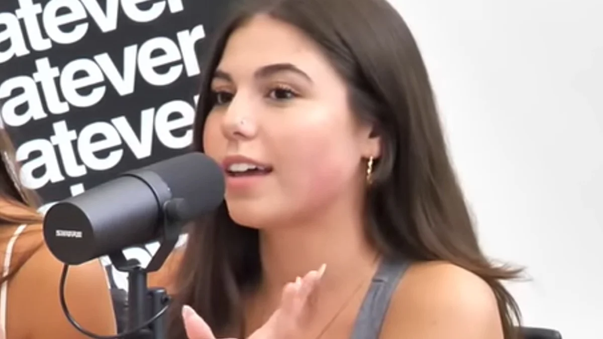 Like Girl Noelani Renee — Noelani Renee speaking into a microphone on the Whatever Podcast set