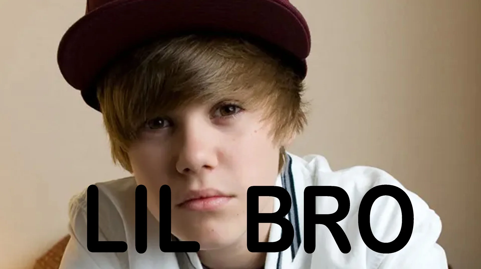 Lil Bro Slang — Young Justin Bieber in a maroon cap with 'LIL BRO' text overlay
