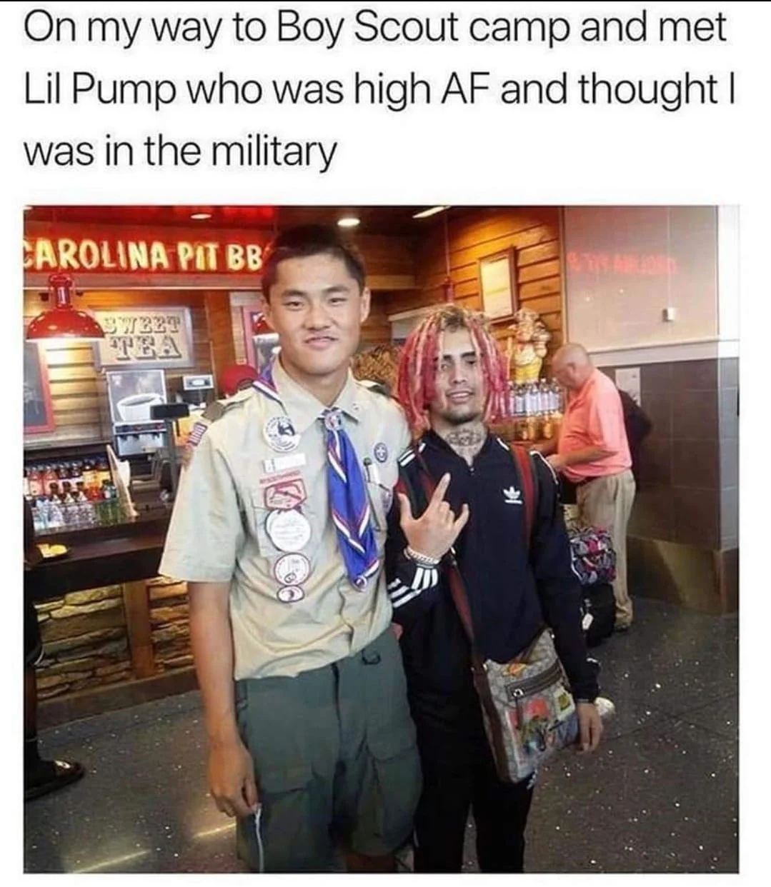 Boy Scout posing with Lil Pump inside a BBQ restaurant with viral caption