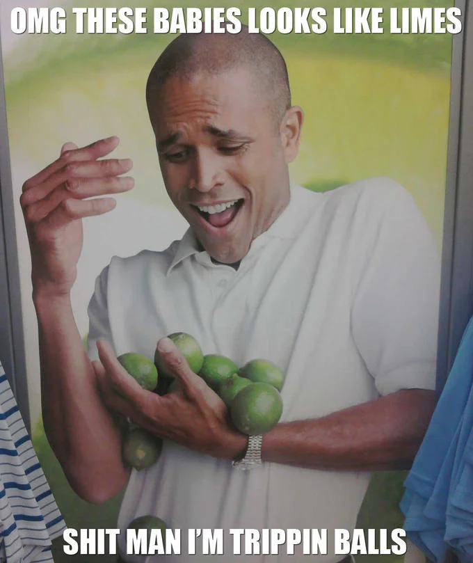 Limes Guy — In-store George brand advertisement panel showing a man holding limes, displayed between red clothing racks.