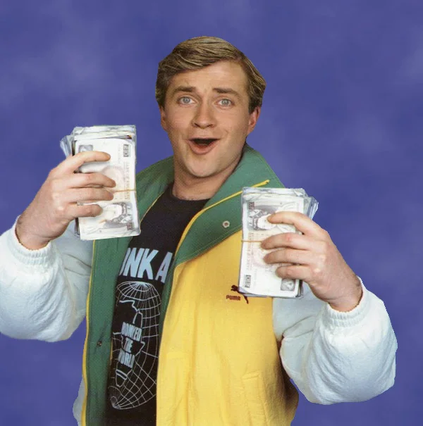 Loadsamoney holding two wads of cash and grinning