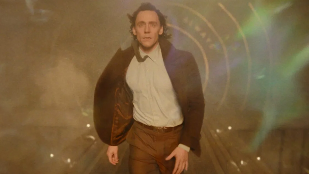 Loki Walk Edits — Tom Hiddleston as Loki walking forward through a hazy corridor with dramatic lens flares, blazer flaring behind him.