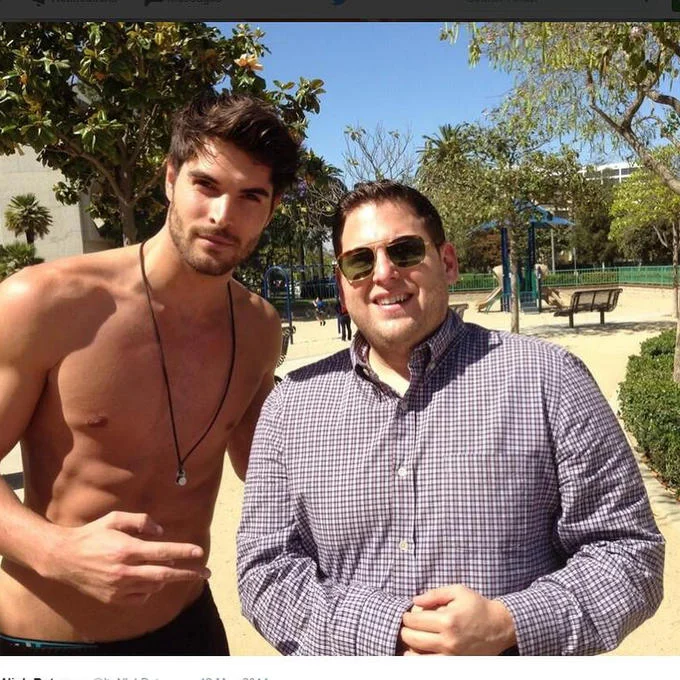 Looksmaxxing — Two shirtless men positioned as before/after transformation images, displaying physique changes through fitness.