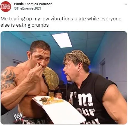 Tweet with a WWE screenshot of Batista eating from a plate, captioned about tearing up a low vibration plate.