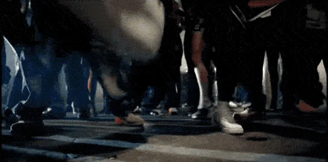 Ludacris Big Shoe Stomp Big Shoe Lmfao — A dark, low-angle GIF frame from Ludacris' 2003 'Stand Up' music video showing an enormous white Nike sneaker
