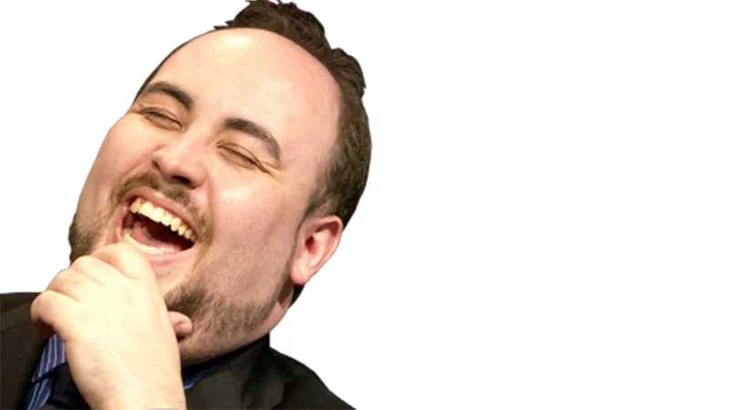 TotalBiscuit laughing with hand near chin, source of the LUL emote