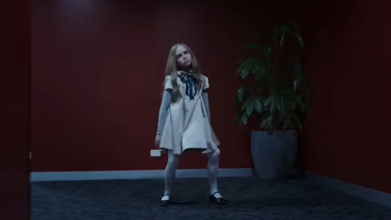 M3GAN Dancing — M3GAN in her signature white dress performing her iconic dance move in the film's hallway scene.