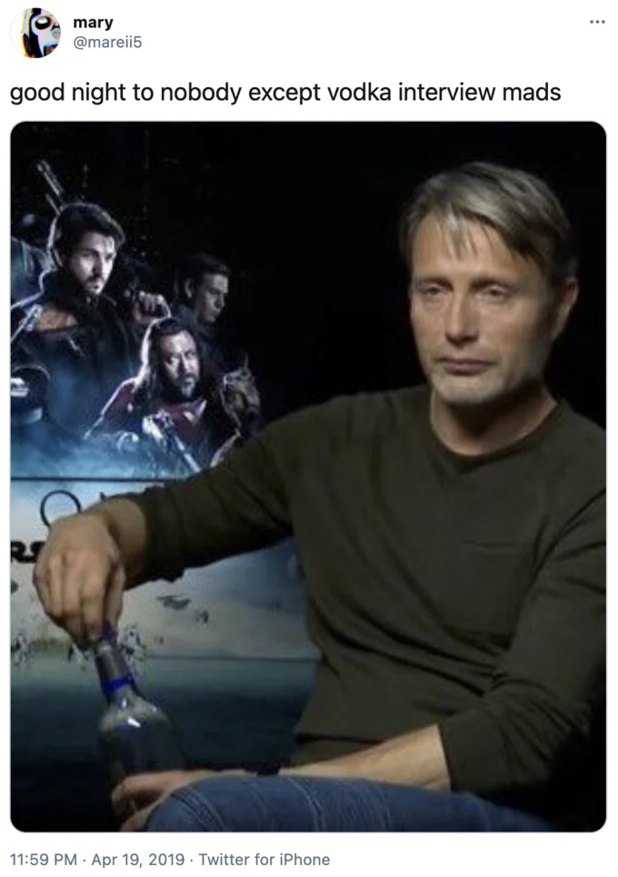 Mads Mikkelsen Opening Vodka During Interview — Twitter post by user 'mary' featuring the iconic meme image of Mads Mikkelsen with drink and Rogue One poster.