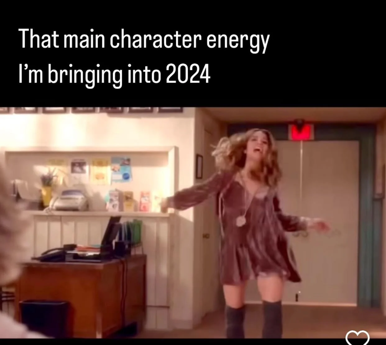 Woman striking confident pose with text 'That main character energy I'm bringing into 2024'