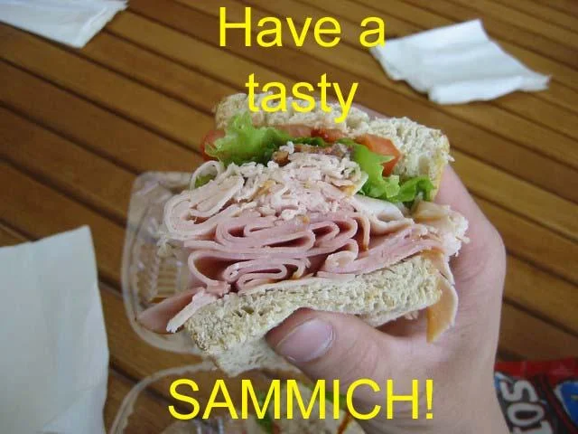 Make Me a Sandwich — Hand holding a deli sandwich with caption 'Have a tasty SAMMICH!'