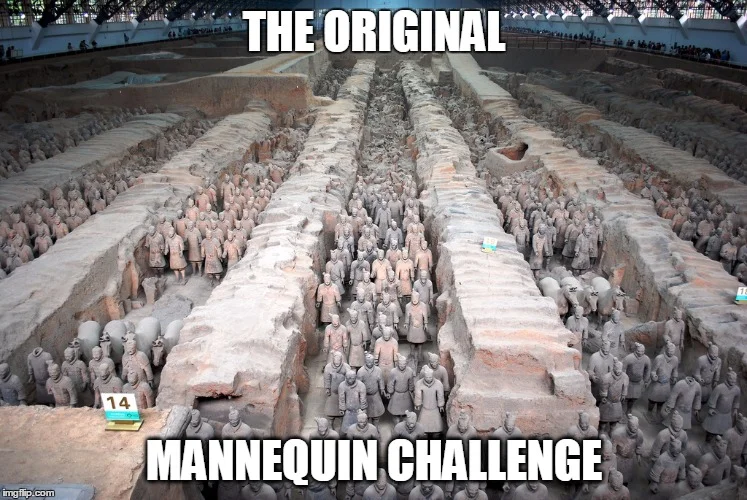 Mannequin Challenge — A group of people frozen in unified yet varied poses on a couch, demonstrating creative posing with different expressions and body