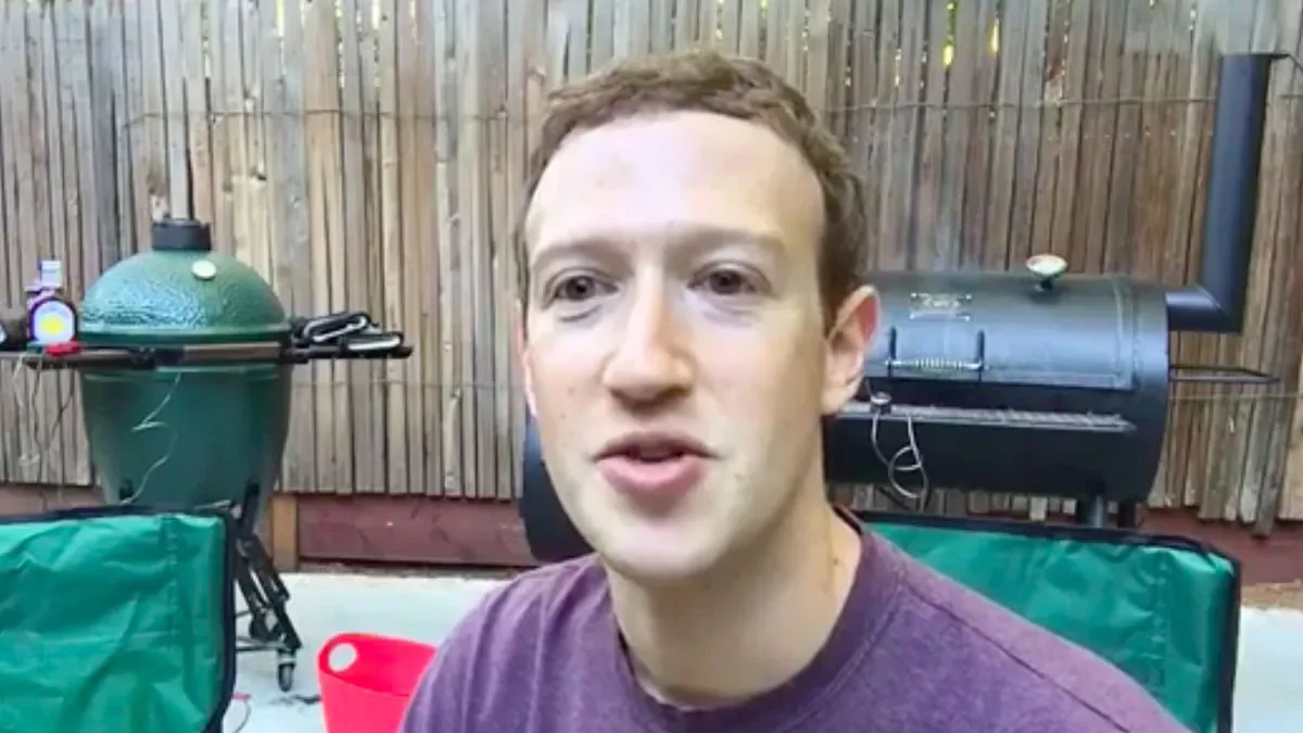 Mark Zuckerberg Smoking Meats — Mark Zuckerberg on camera in his backyard flanked by a Big Green Egg and an offset meat smoker