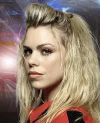 Mary Sue — A promotional-style portrait of a blonde woman in red outfit styled against a cosmic, space-inspired background.