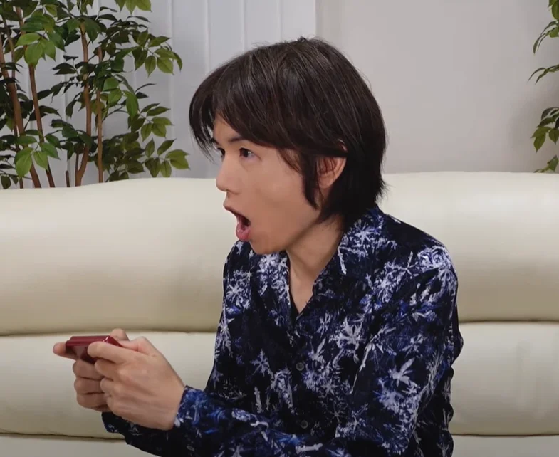 Masahiro Sakurai — Sakurai on his YouTube show with subtitle reading 'It's true, I stole it all from Kart Fighter'.