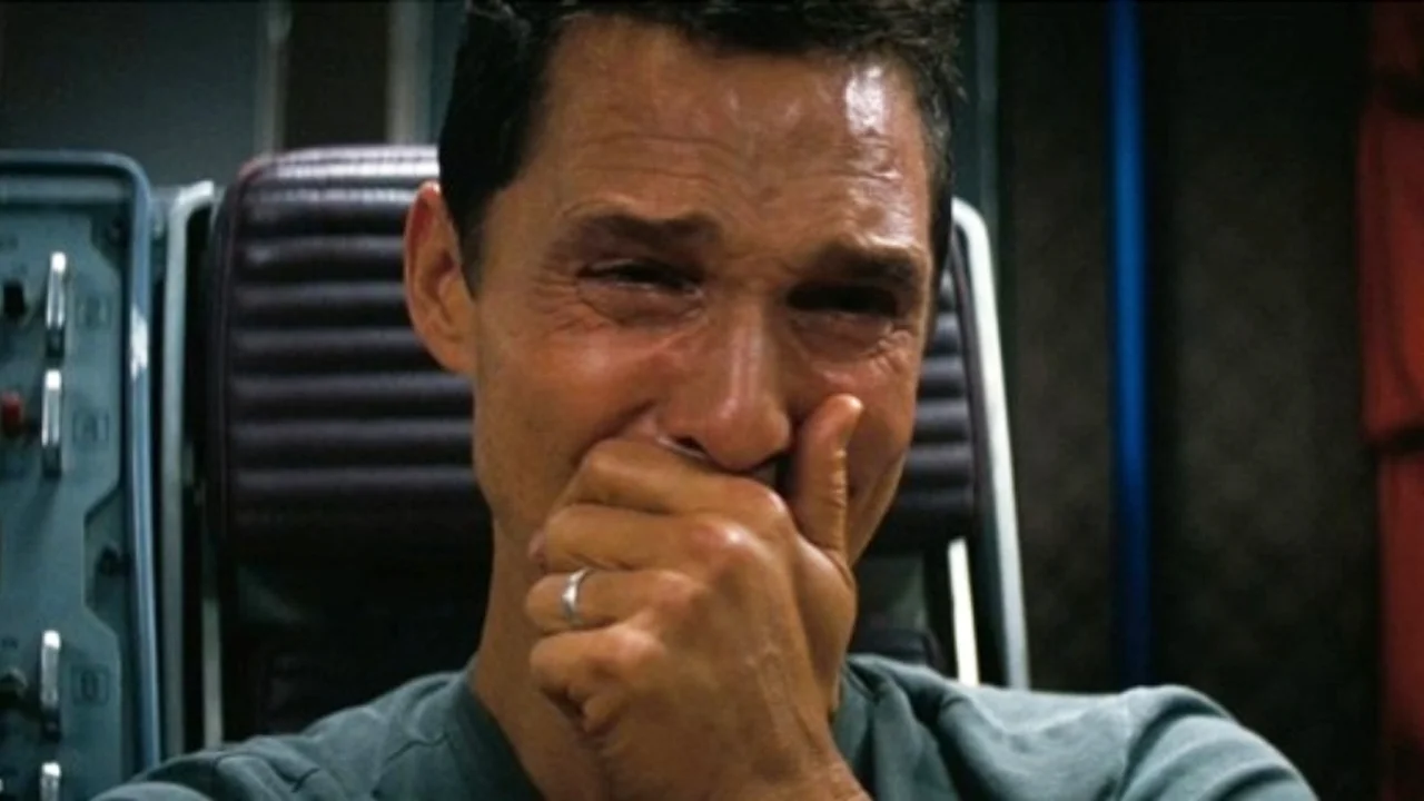 Matthew McConaughey Crying (Interstellar) — Matthew McConaughey crying with hand over mouth in a spaceship scene from Interstellar