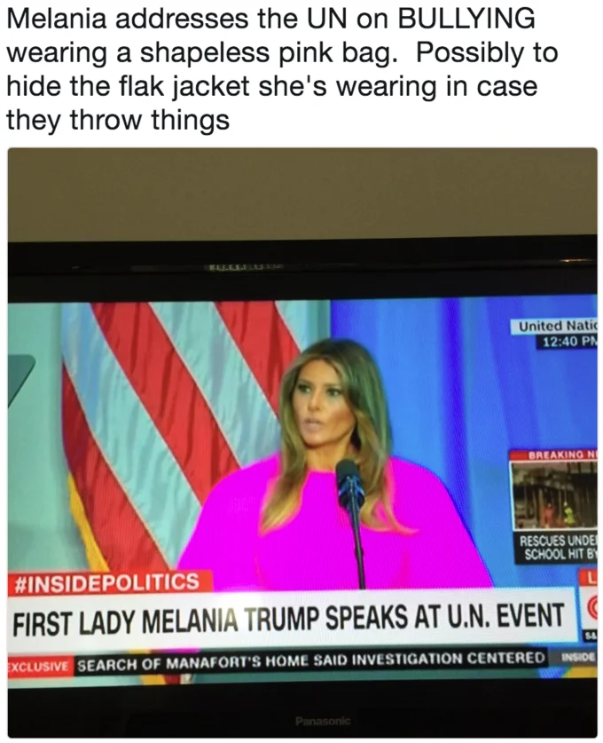 Melania Trumps Un Speech Dress — Smartphone photo of a television displaying CNN coverage of Melania Trump speaking at the UN in her hot pink dress with a flak