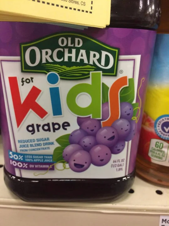 Old Orchard grape juice bottle with smiling purple grapes resembling Member Berries