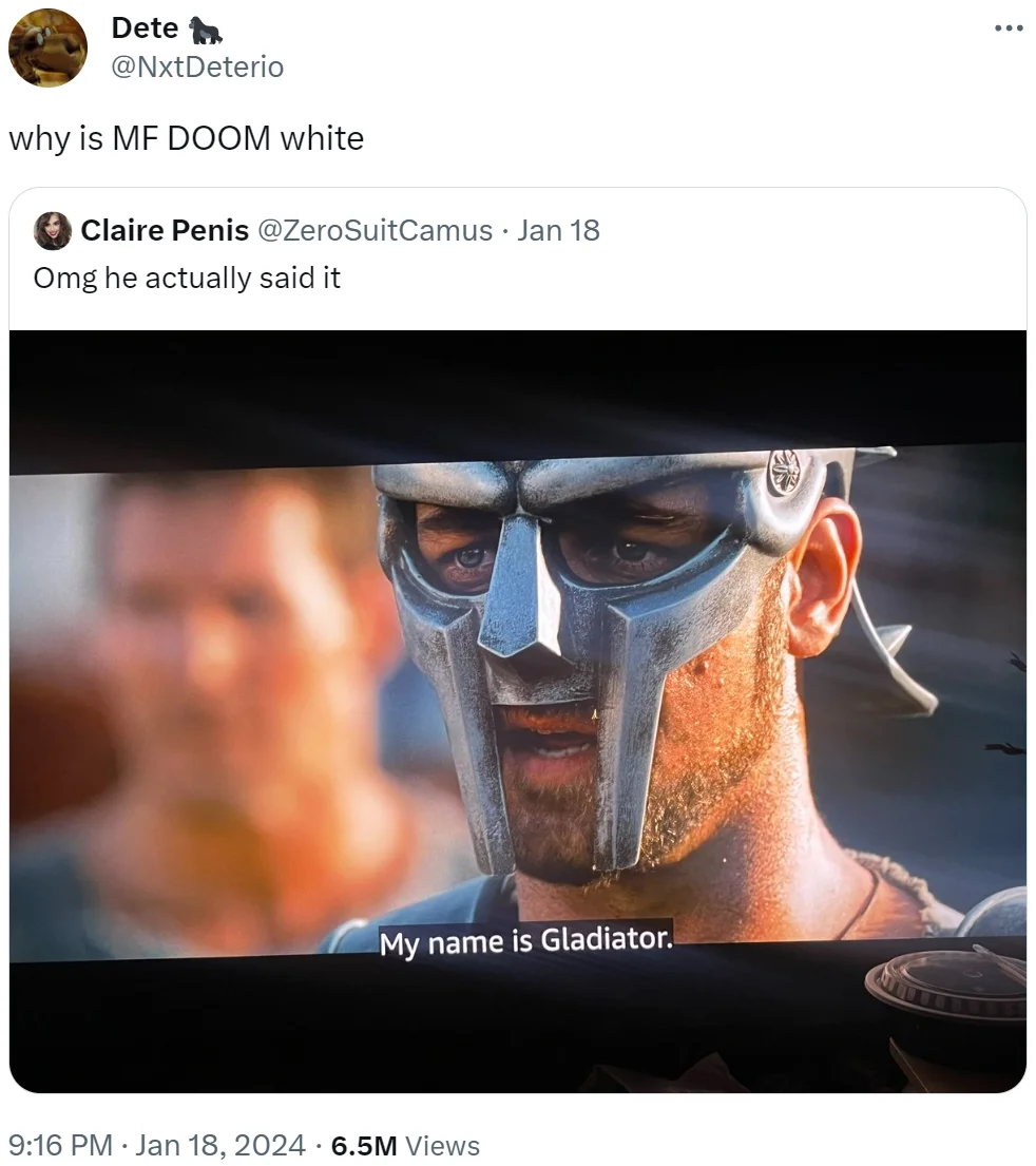 MF DOOM — Hand holding a small printed photo of a young child