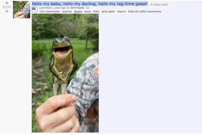 Michigan J Frog Dance Hello My Baby Hello My Honey — Screenshot of an Imgur post showing a real green frog with mouth open wide held by a person, titled with