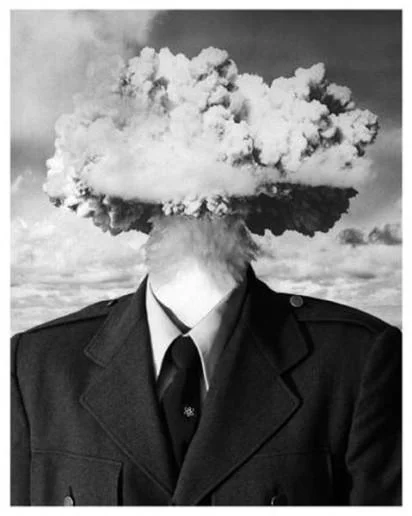 Mind = Blown — Black and white image of a man in a suit with a mushroom cloud in place of his head