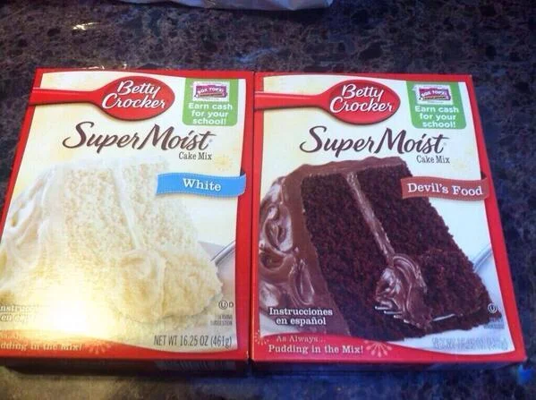 MLK Didn't Die For This — Two Betty Crocker cake mix boxes labeled 'White' and 'Devil's Food' side by side.