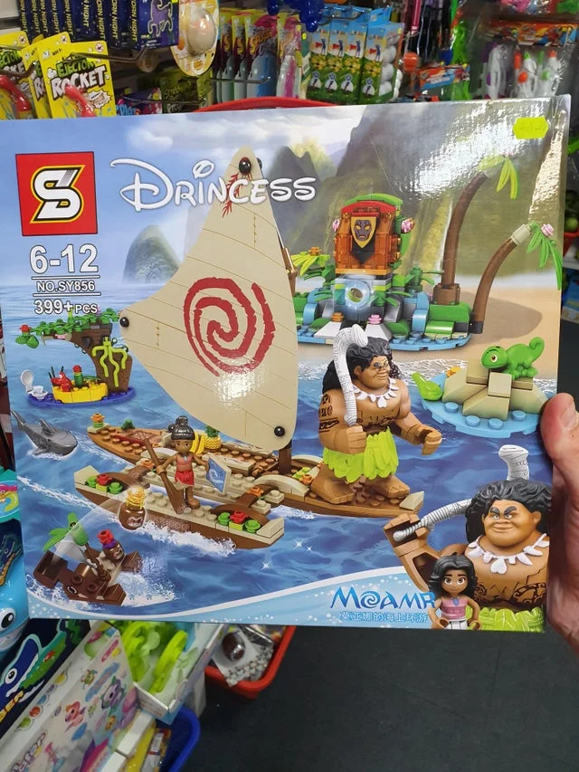 Bootleg Moana Princess-branded LEGO-style toy set in packaging held in a store.