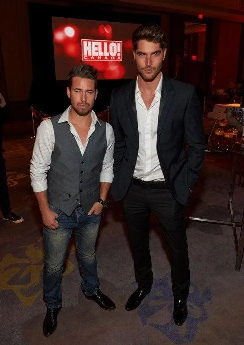 Mogging — Two men in formal wear, one notably taller and more imposing