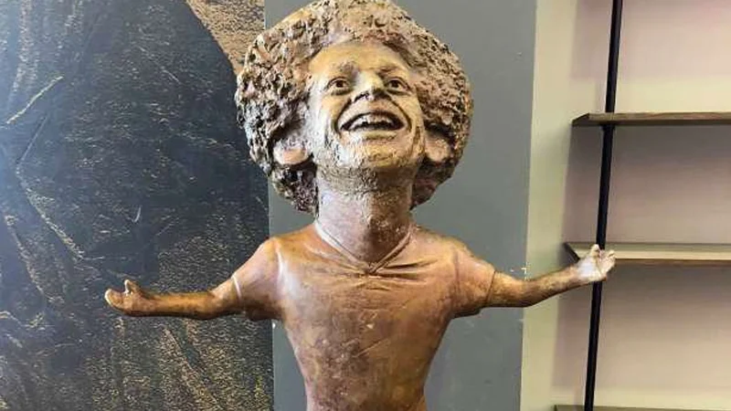 Mohamed Salah Statue — Bronze statue of Mohamed Salah with arms outstretched and a wide grin