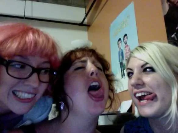 Moon Over June — Three young women taking a selfie while making exaggerated silly faces