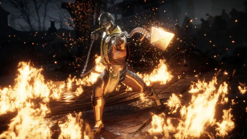 Mortal Kombat 11 PTSD Controversy — Scorpion from Mortal Kombat 11 posing with kunai and chain amid flames
