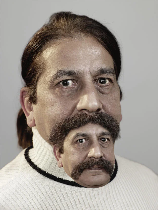 Moustair — Man in white turtleneck with a moustache formed from a smaller face bearing the same moustache