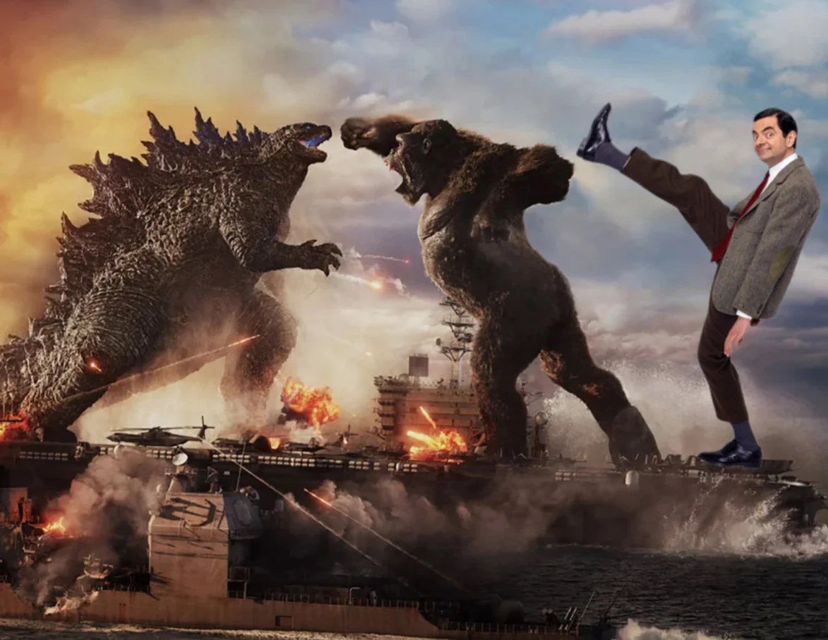 Mr. Bean taking a selfie in front of Godzilla